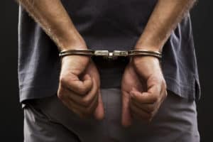 Close-up. Arrested man